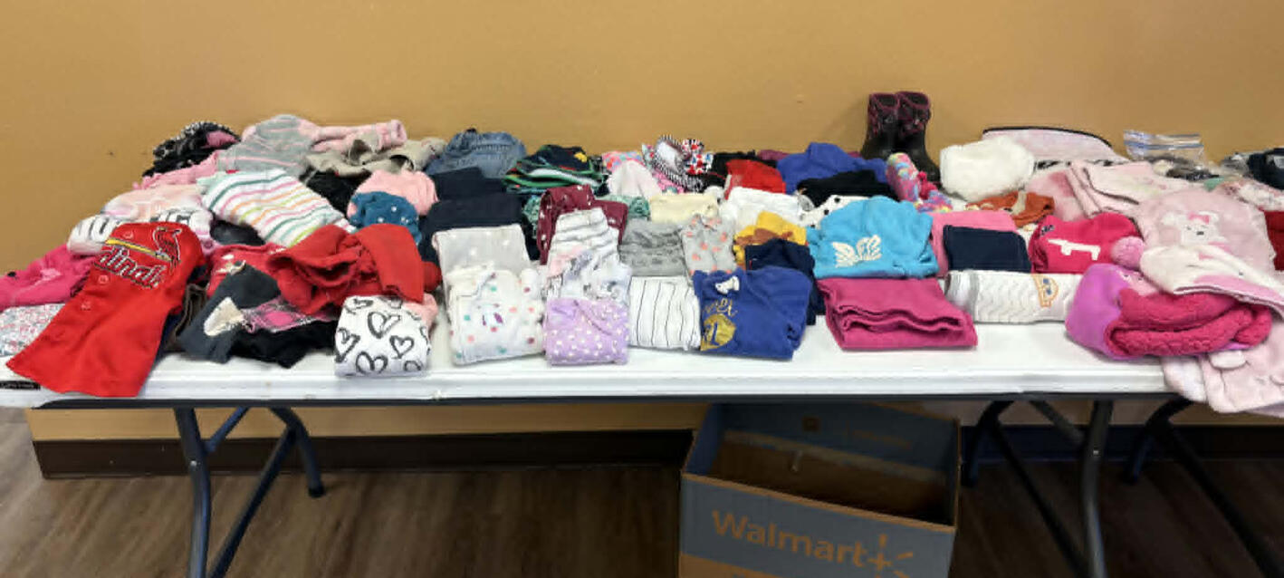 Tables of clothes at our Clothing Swap & Craft Social
