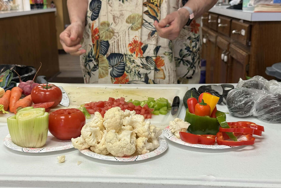 Learning about knife techniques and making veggie trays at our Household Good Swap & Cooking Demonstration event
