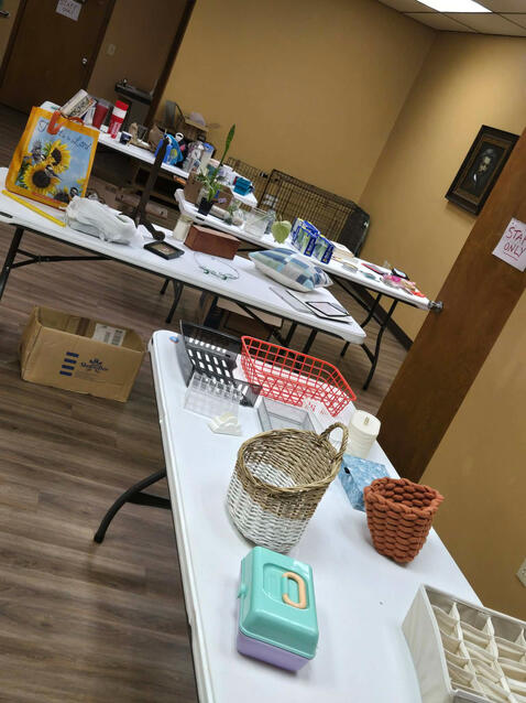 Tables of donations at our Household Good Swap & Cooking Demonstration event